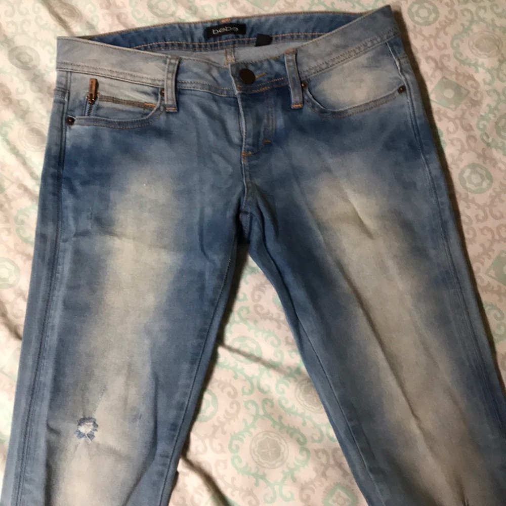 BEBE light wash faded skinny jeans